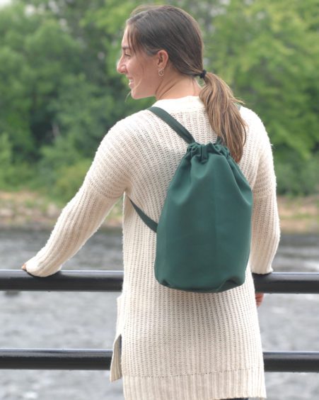 Very-Happy-with-Her-Drawtop-Backpack-by-the-River